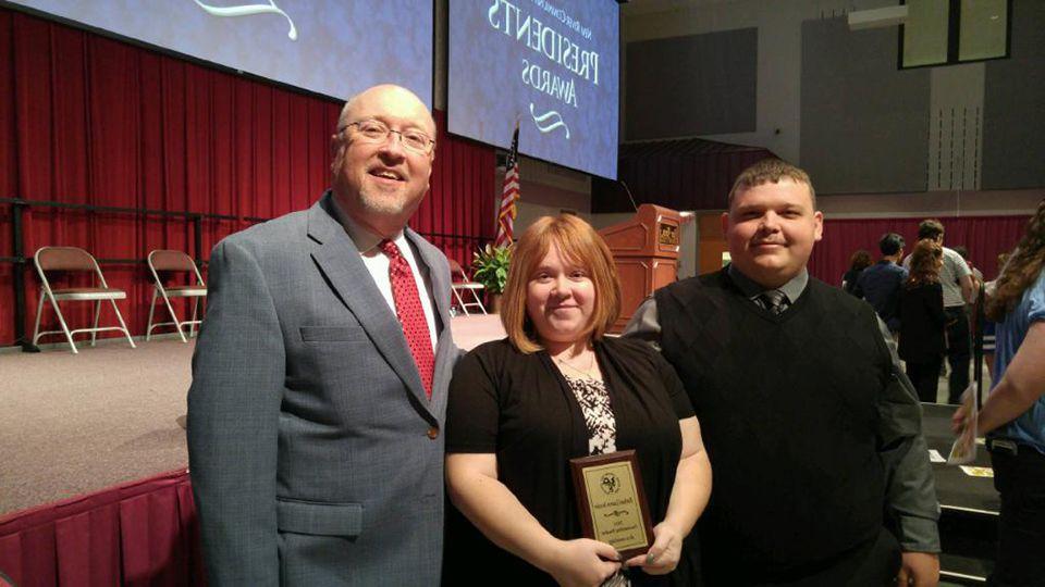 Pictured from left: Bessler's husband Joshua Bessler, Rachael Bessler, and T. Ray Wurzburger, Associate Professor of Accounting.