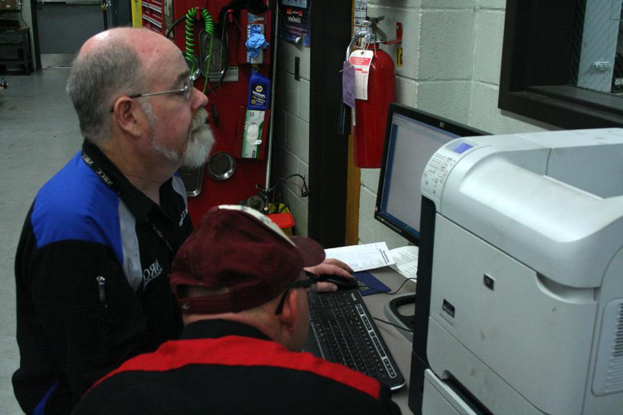 teacher and studnet in auto lab